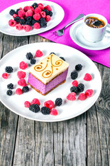 a piece of cake souffle with blackberries, raspberries, closeup