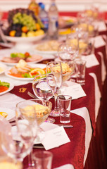 catering table set service with silverware, napkin and glass at restaurant before party