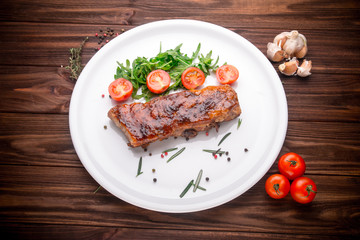 Delicious barbecued ribs seasoned with a spices and fresh herbs