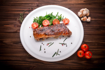 Delicious barbecued ribs seasoned with a spices and fresh herbs