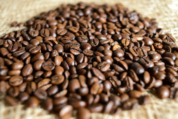 Roasted brown coffee beans, can be used as a background and texture