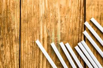 Cigarettes on grunge wooden background with copy space
