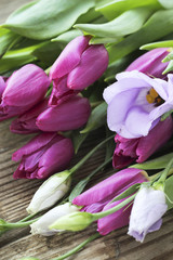 Bouquet of fresh purple tulips and eustoma flower