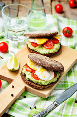 smashed avocado, tomatoes, egg sandwich