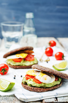 smashed avocado, tomatoes, egg sandwich