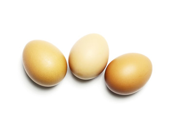 Three eggs on white background