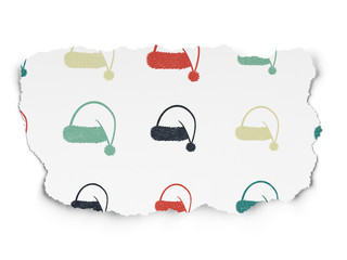 Entertainment, concept: Christmas Hat icons on Torn Paper background