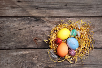 Easter color eggs on old wooden table
