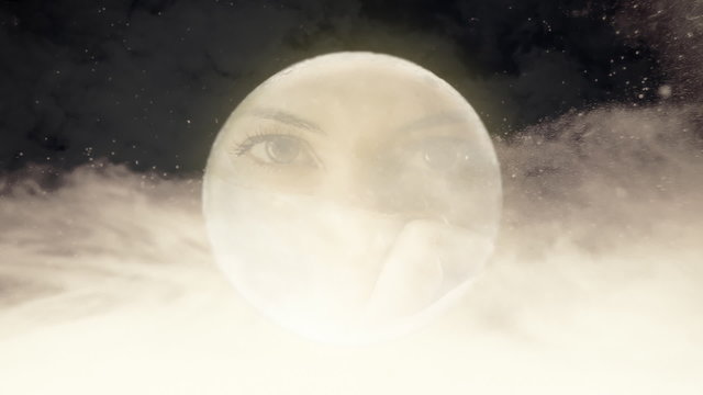 The mysterious face of a vintage girl in a full moon on a cloudy night. Front view.