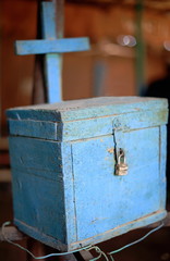 Christian donation box painted blue. Tavern in Afrera-Ethiopia. 0179