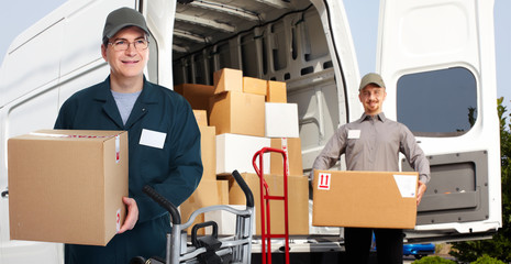 Delivery man near shipping truck.