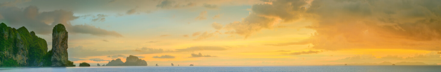 Naklejka na ściany i meble sunset with colorful sky and boat on the beach
