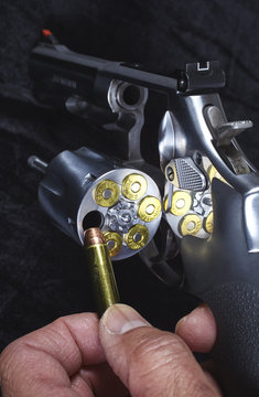 Man Loading Magnum Revolver Closeup