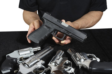 Man with guns pistols and revolvers for sale