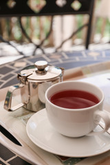 Cup of fruit tea on the table