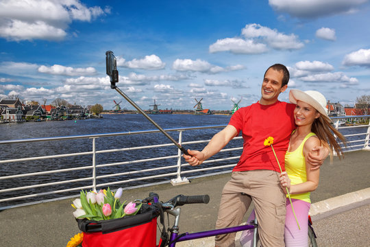 Selfie against canal with windmills in Zaanse Schans, Holland