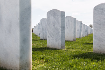 Up-close view of rows of headstones at Miramar National Cemetery in San Diego, California.