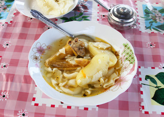 Bowl of Chicken Soup with Potatoes