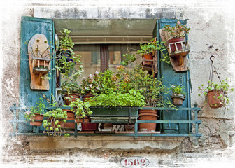 Fototapeta na wymiar Venice, old small windows with plants