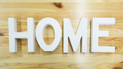 The word Home on the wooden background