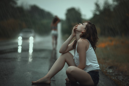 Woman in the rain and sad.