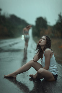 Woman suffering in the rain.