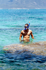 man with snorkel in lagoon