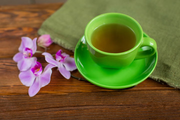 Fototapeta na wymiar good morning. cup of tea on a wooden background