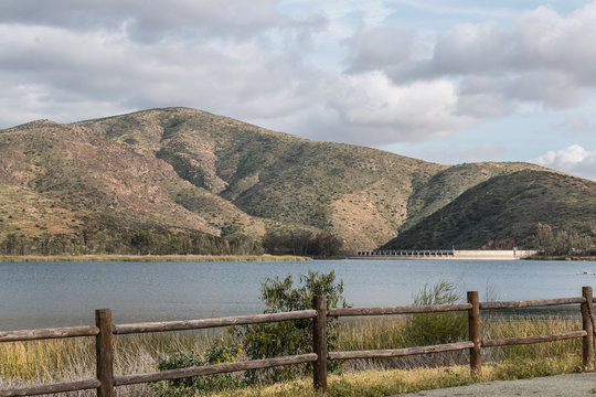 Mountain Range, With Reservoir, Lake And Fence Line At Otay Lakes County Park In Chula Vista, California. 