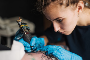 tattooing black and white, plugging sleeves, sterile gloves