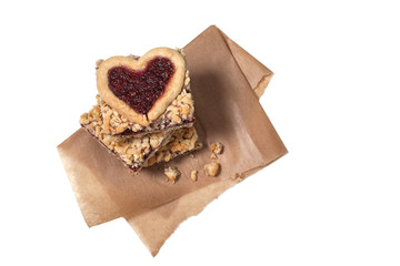 .cup of cappuccino with homemade pastries pie raspberry jam and berries on a wooden board.