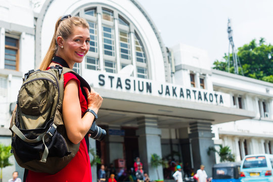 Tourist at sightseeing with bagpack in Indonesia