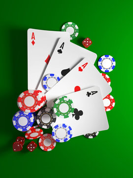 casino chips, dice and cards for poker on green background