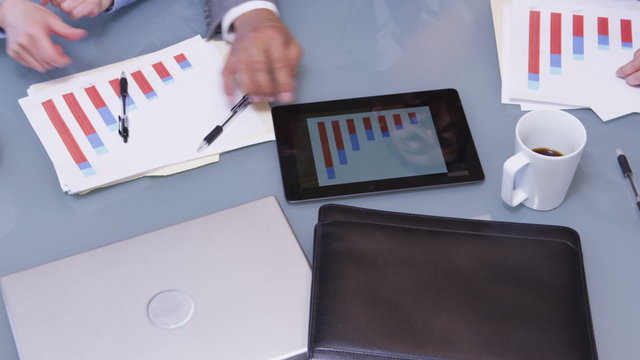 Group of business people using digital tablet in meeting