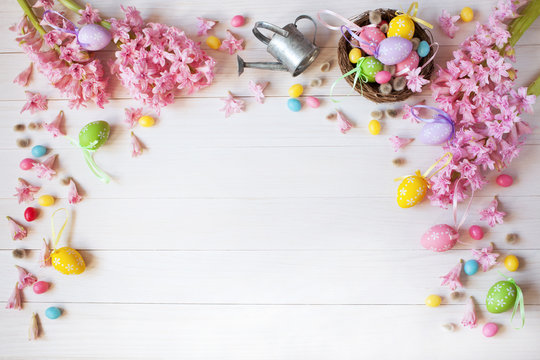 Easter background with flowers hyacinth, nest and colored eggs
