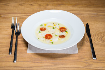 cod on mashed potatoes and tomato confit