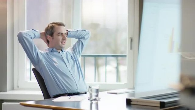 business man at office desk making the right descision