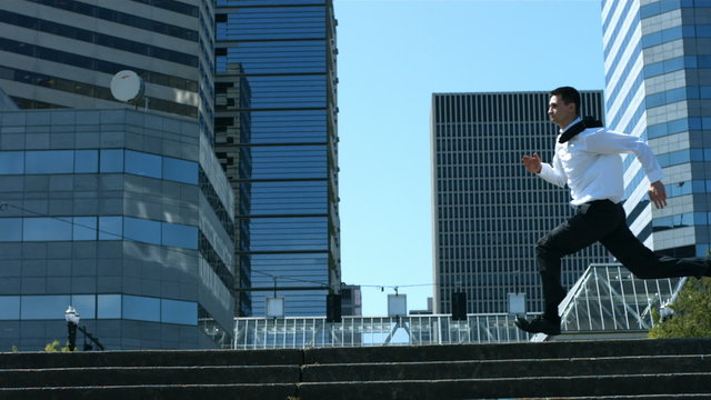 Business men running in city, slow motion