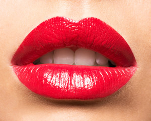 Woman's lips with red lipstick.