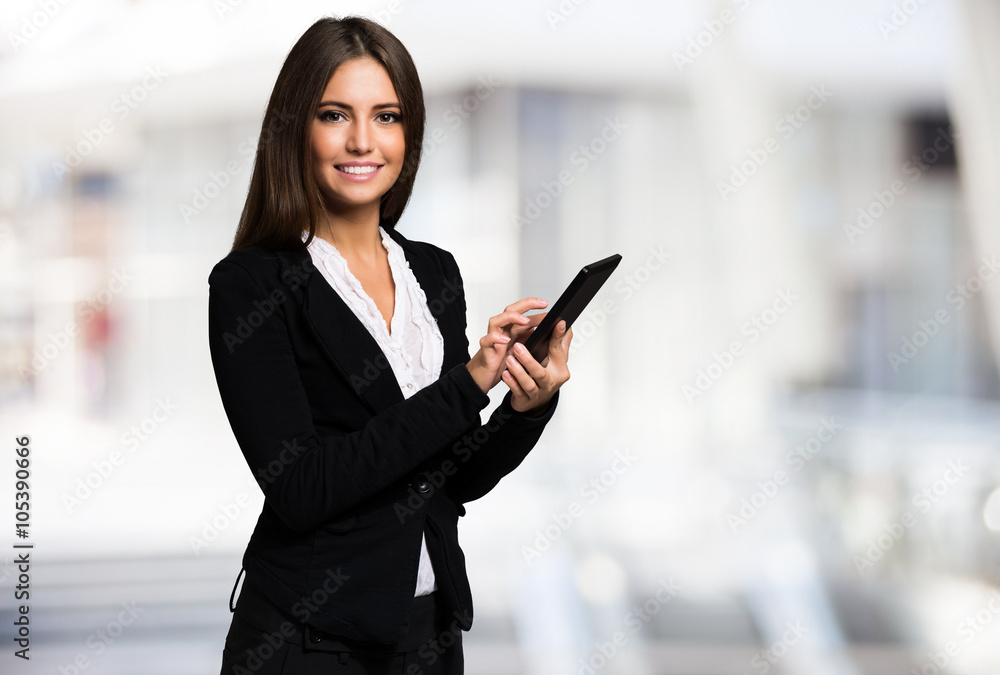 Wall mural businesswoman using a tablet