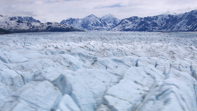 Aerial tracking shot over Alaskan glacier