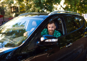 Bearded man in the car