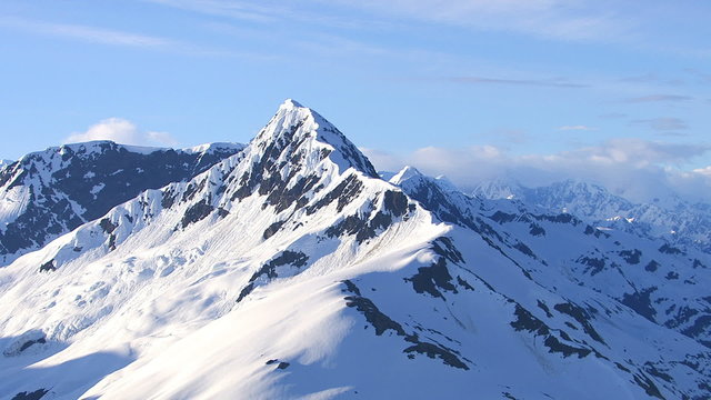 Aerial shot of snowy mountain peak, Alaska