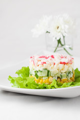 Crab sticks salad on white tablecloth