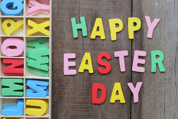 The text is Happy Easter Day on wood background.