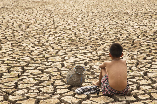 A lone children in the  arid area