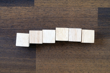 Wooden cubes on wood background