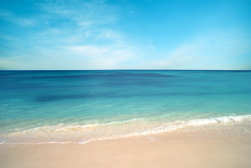 Fototapeta premium Nature background, clear water and blue cloudy sky pastel colors