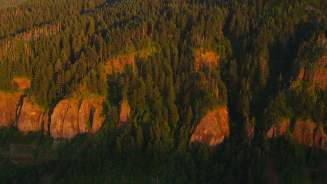 Aerial shot of cliffs and forest at sunset, Oregon
