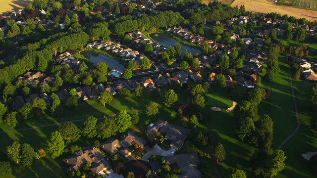 Aerial shot residential homes and farmland